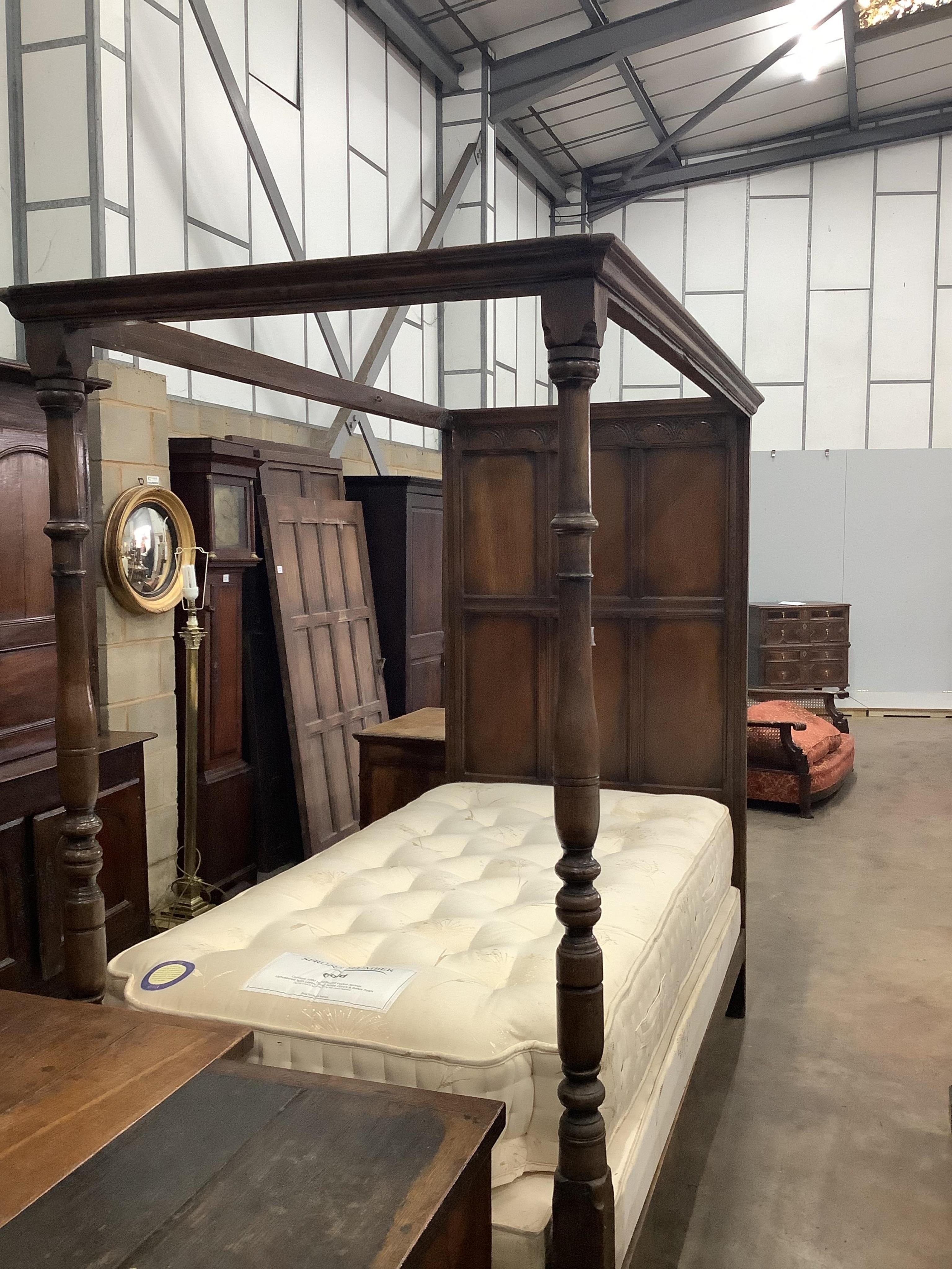 An 18th century style oak single four poster single bed frame, together with a mattress, width 107cm, length 215cm, height 104cm. Condition - fair to good